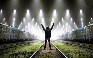 men's black jacket, men, train station, railway, lights