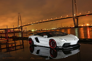 landscape photography of sports car near body of water and bridge HD wallpaper