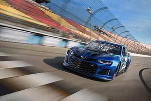 blue Chevrolet racing car on track