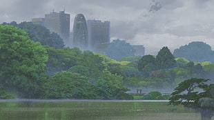 city building beside trees and body of water during day time