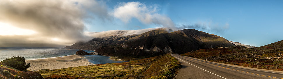 gray concrete road near body of water and mountains, big sur HD wallpaper