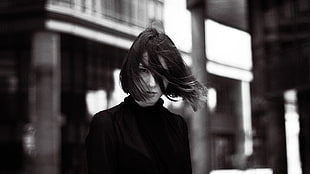 grayscale photography of a woman wearing turtle neck top