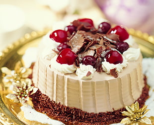 close-up photo of cherry and chocolate topped round cake