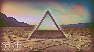 pyramid on drought land digital wallpaper