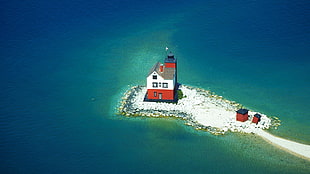 red and white house near body of water during daytime, lighthouse, island, sea, waves