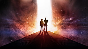 man and woman holding hands looking at portal