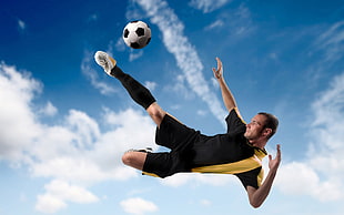 soccer player kicking the soccer ball mid air close-up photo HD wallpaper