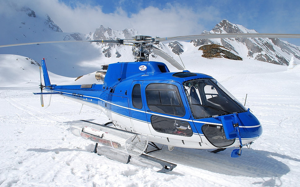 white,blue and black helicopter in snow field HD wallpaper
