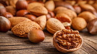 bunch of nuts, nuts, closeup, food, wooden surface HD wallpaper
