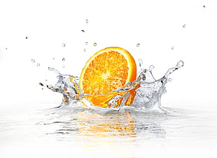 sliced orange fruit on water