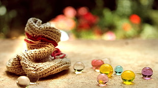 selective photography of marble balls beside pouch HD wallpaper