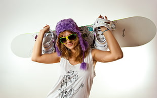 woman carrying snowboard