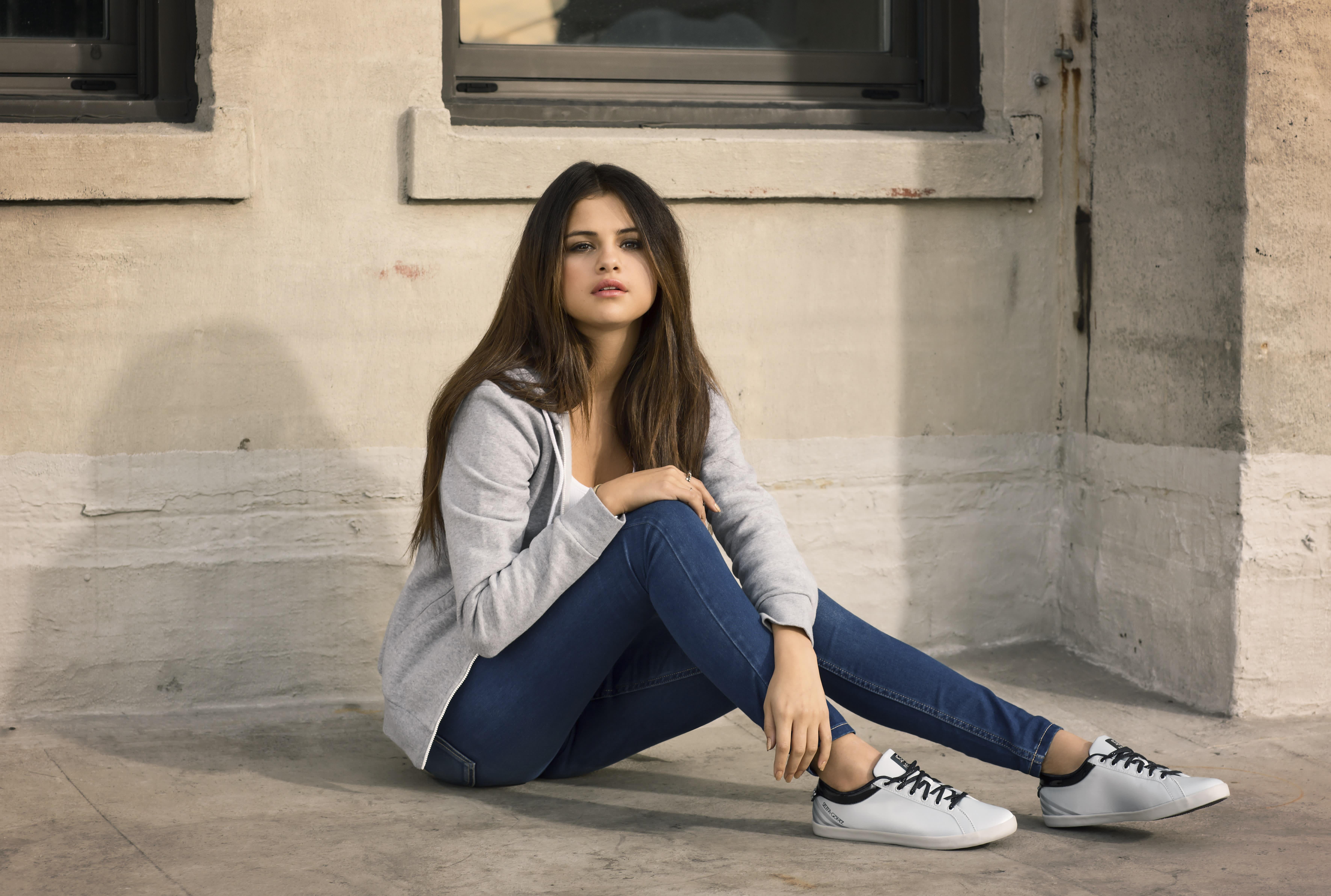 Woman In White Crew Neck Shirt And Black Leggings Sitting On Sofa Images, Photos, Reviews