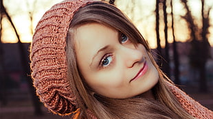 brown haired woman in brown knit cap