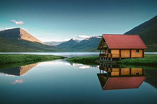 red and yellow wooden house, Iceland, mountains, water, cabin
