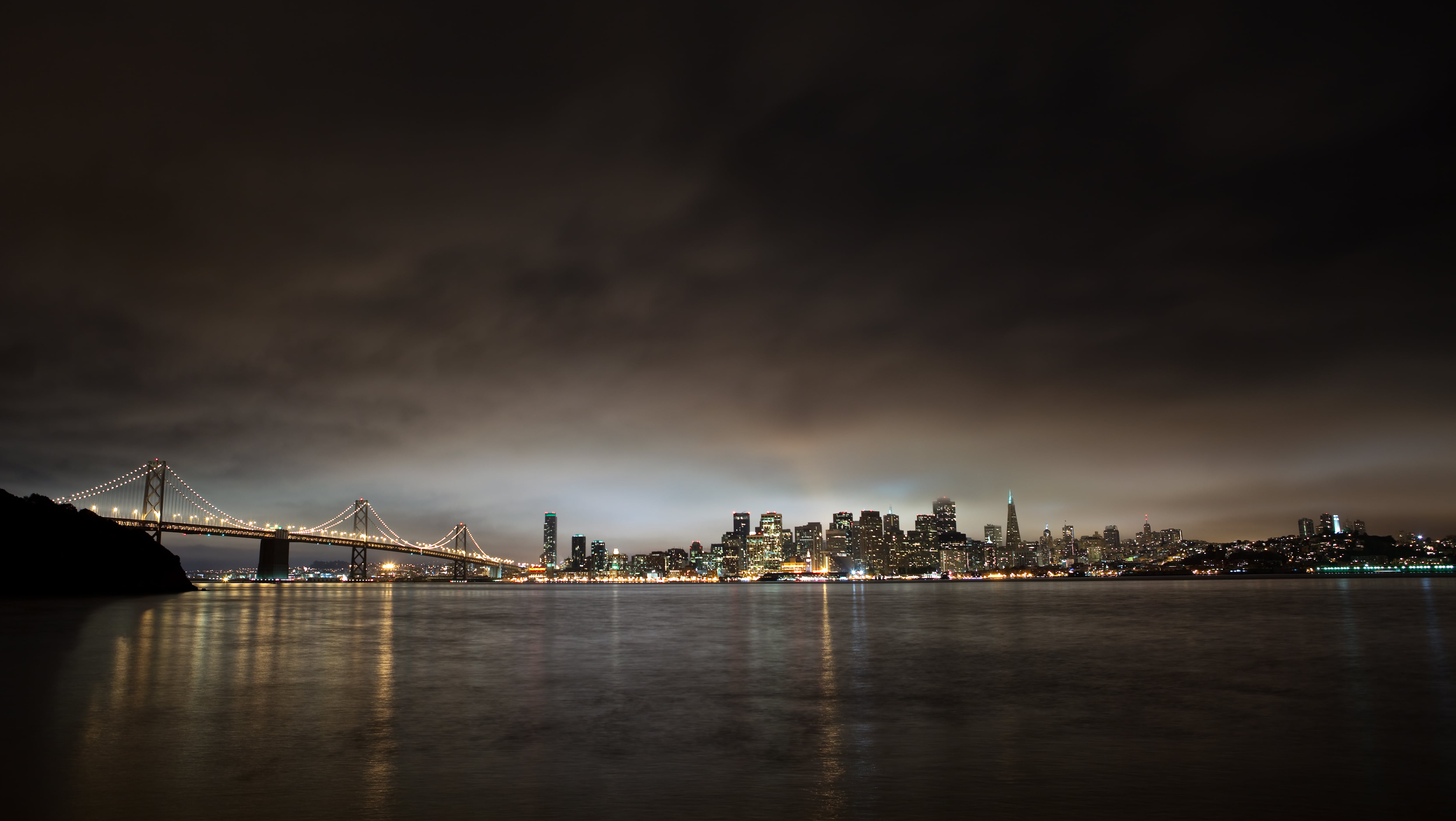 cityscape picture Brooklyn Bridge during night time, san francisco