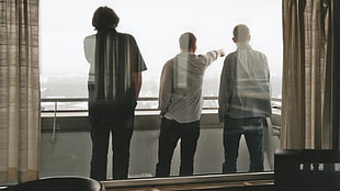 three men standing outside the veranda HD wallpaper