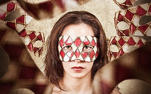 woman wearing white and red festival mask