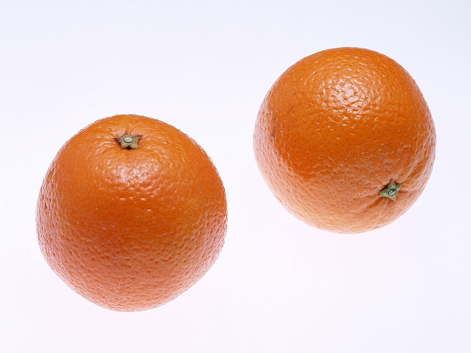 two orange fruits HD wallpaper