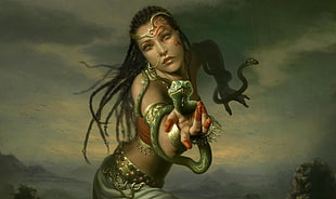 black hair woman holding green snake