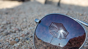 stainless steel framed sunglasses on sand HD wallpaper