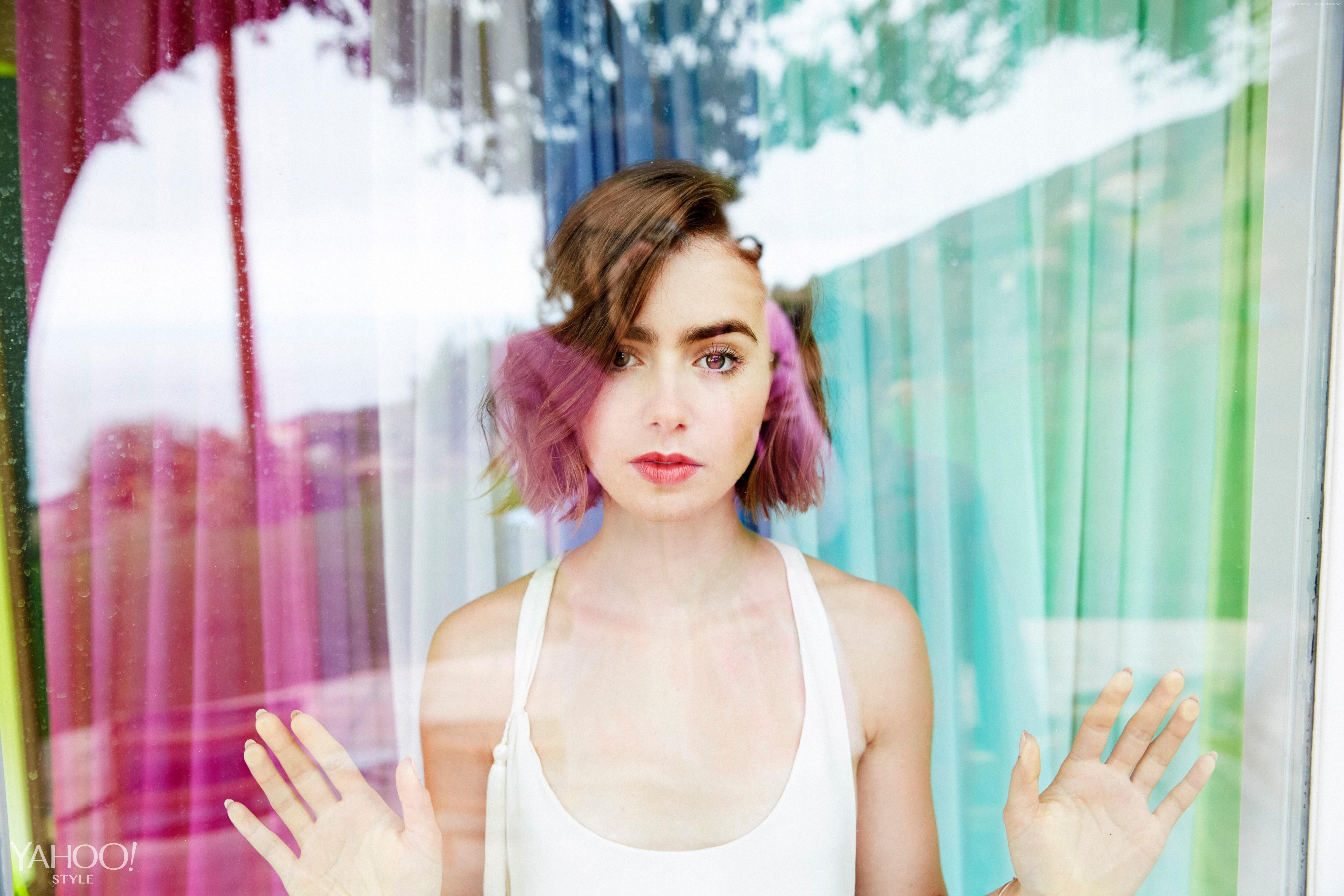 woman in white sleeveless top standing infront window during daytime