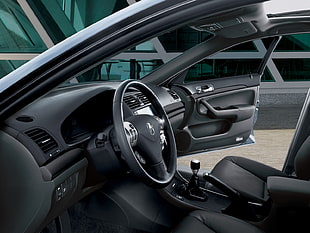 black car steering with car seat in car interior