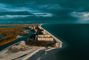 aerial photography of buildings near coastline, USA, shore, coast, sand