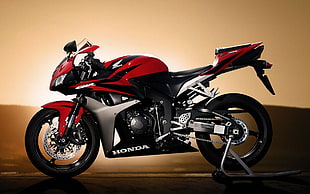 red, black and gray Honda sports bike
