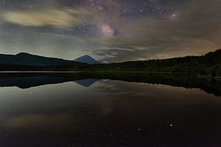 calm body of water at night nature photography, photography, reflection, mountains, stars