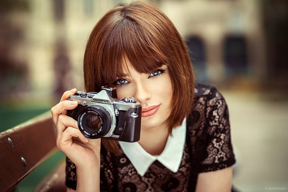 woman holding a film camera HD wallpaper
