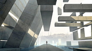 person standing on grey pathway surrounded by concrete blocks overlooking city wallpaper