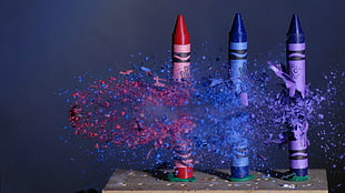 three assorted-color broken crayons, crayons, ammunition, freeze frame, shattered