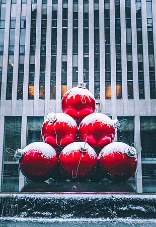 six red Christmas baubles
