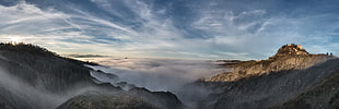 areal photo of mountain with fog, canossa, canossa, italia