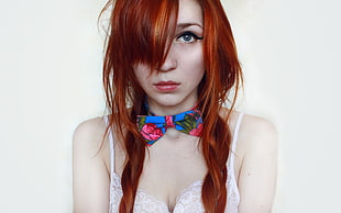 woman with red hair and white brassiere