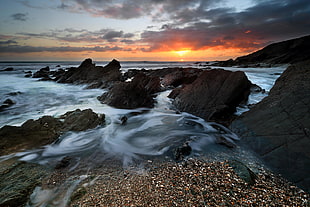 timelapse photography of seashore during sunset photo