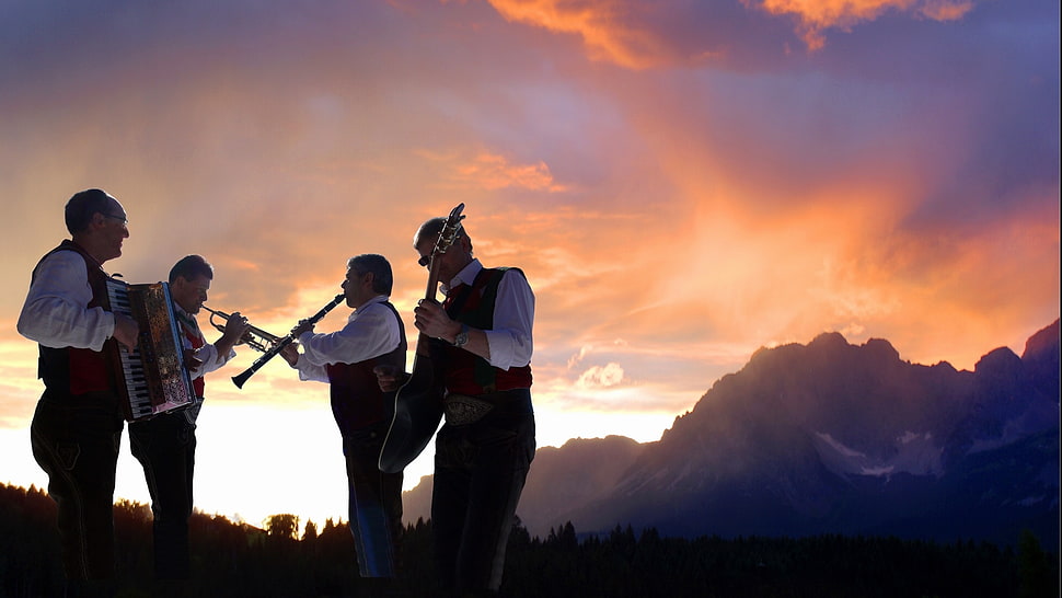 landscape photography of four musicians and mountain under clear sky during daytime HD wallpaper