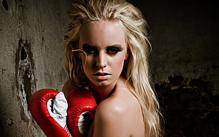 woman wearing a white-and-red boxing gloves
