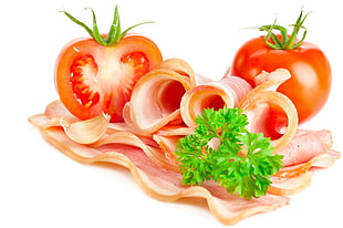 closeup photograph of sliced bacon and tomatoes