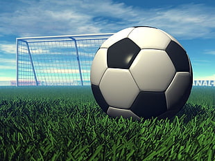 Soccer ball on grass across white goal under cloudy sky during daytime HD wallpaper