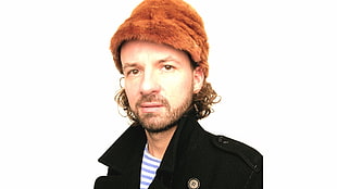 man in black coat and brown knit cap HD wallpaper