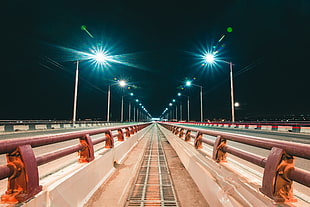 brown transit rail, lights, street light, road, night HD wallpaper