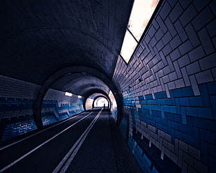 grey and blue tunnel road
