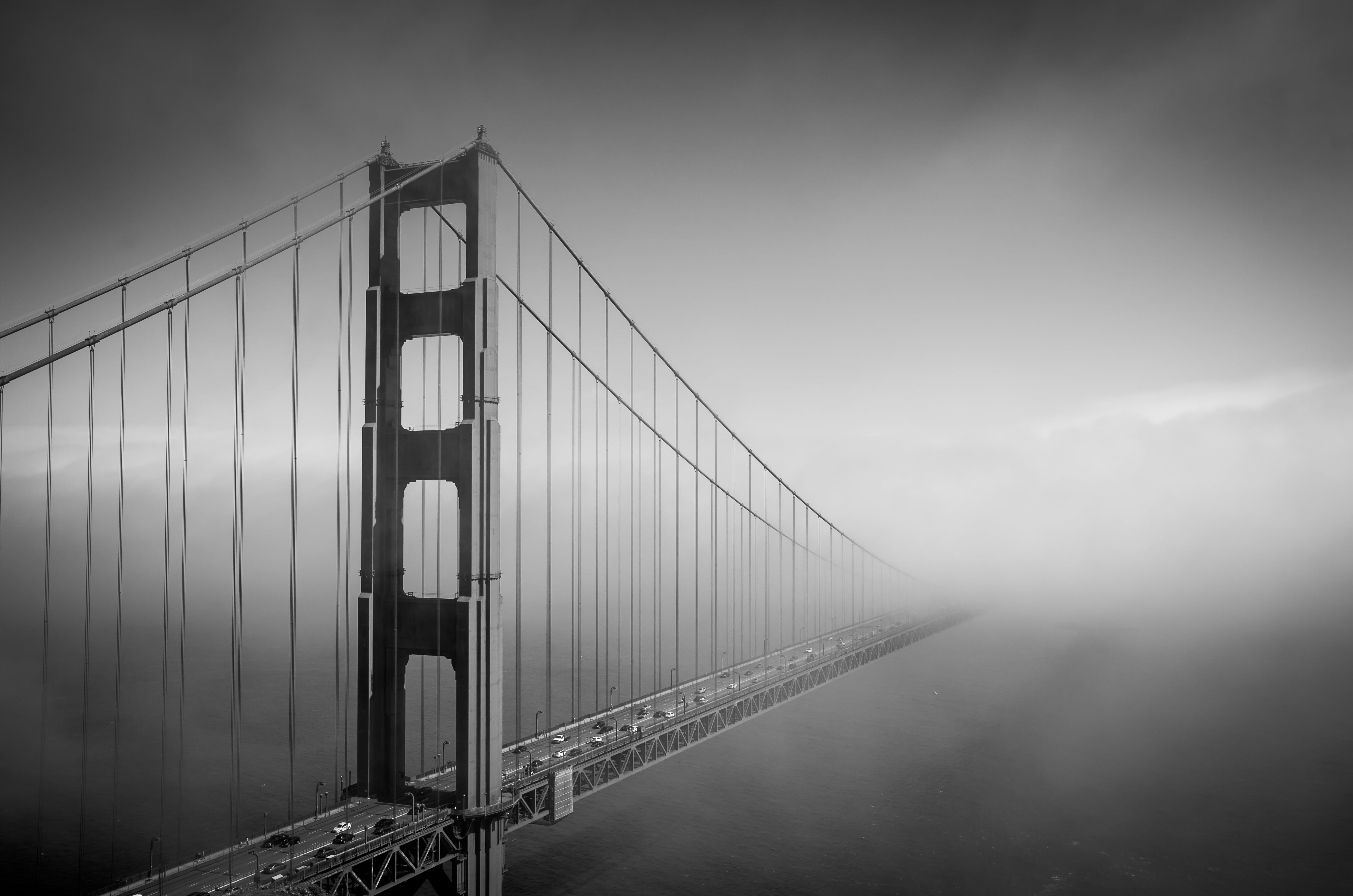 gray scale photo of bridge