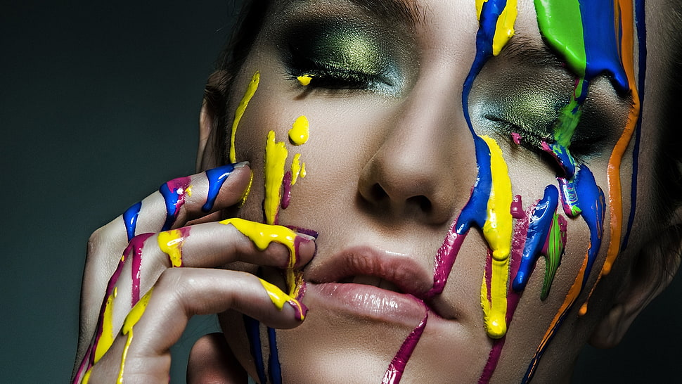 woman with blue, yellow, and green body paint on face HD wallpaper
