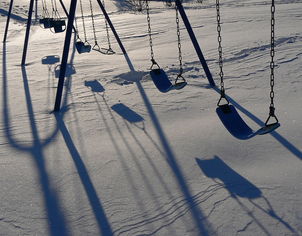 photo of black playground swing on snow HD wallpaper
