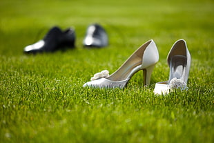 women's pair of white pumps on grass
