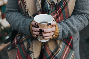 woman holding disposable cup of coffee with 3/4 left HD wallpaper