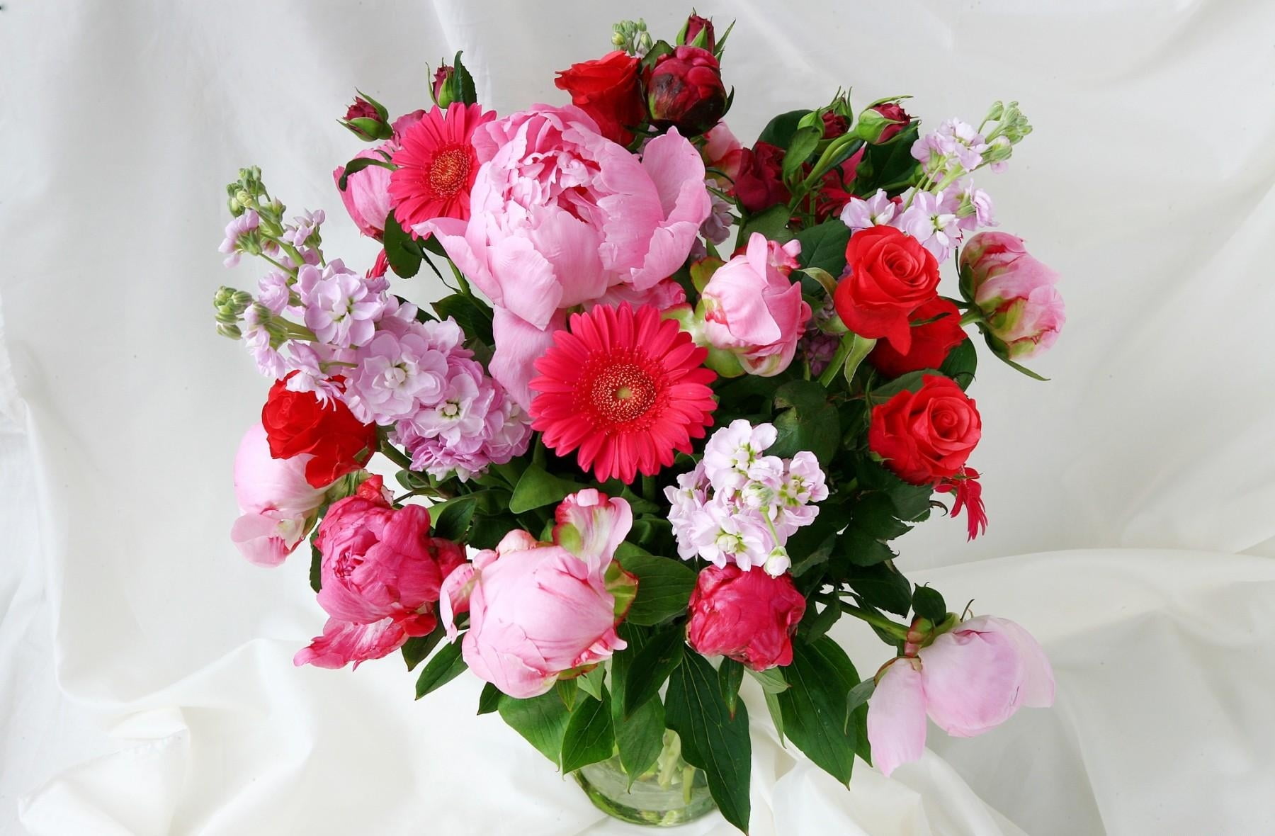red and pink flower arrangement